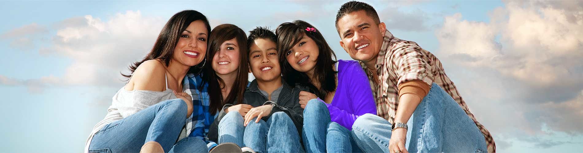 Parents and children sitting and smiling